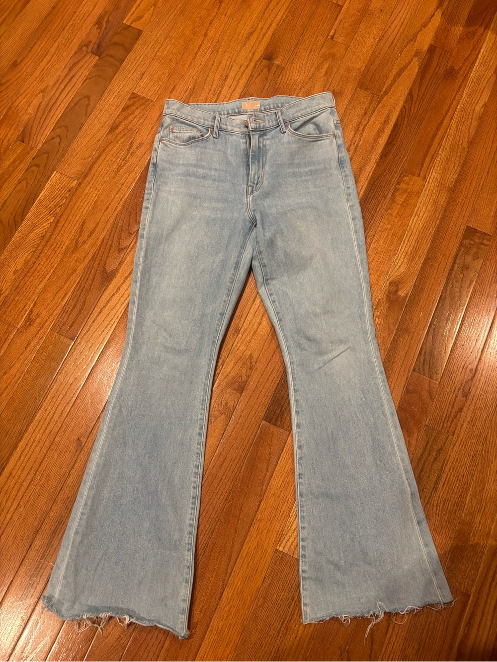 MOTHER Light Blue Flare Jeans with Raw Hem
Size 29